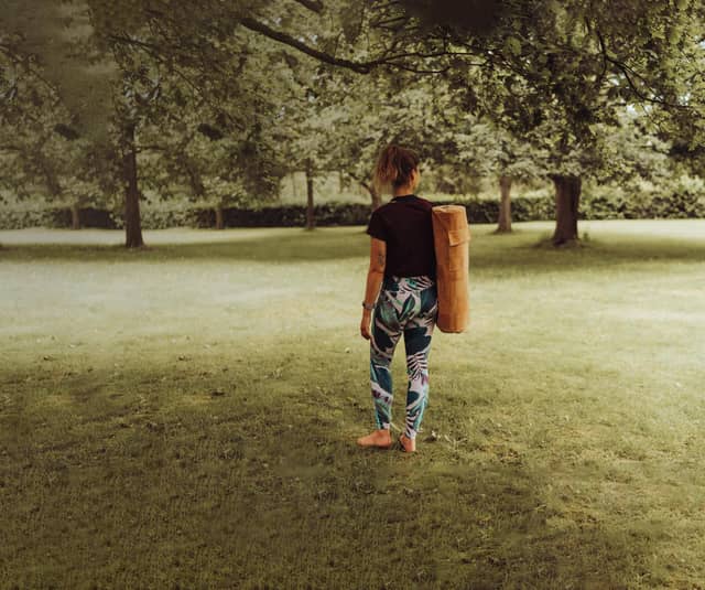 Woman Carrying PIERRE Cork Yoga Mat