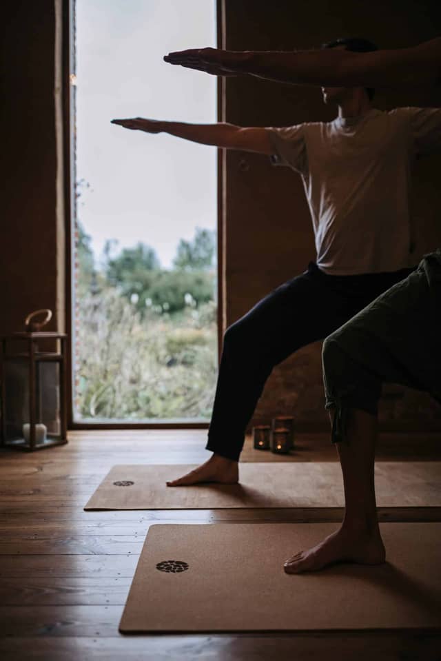 People Practicing Warrior Pose On PIERRE Cork Mats