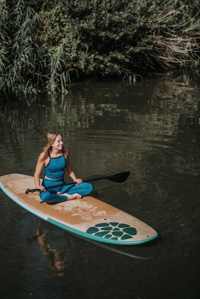 Woman Sitting On PIERRE Paddle Board
