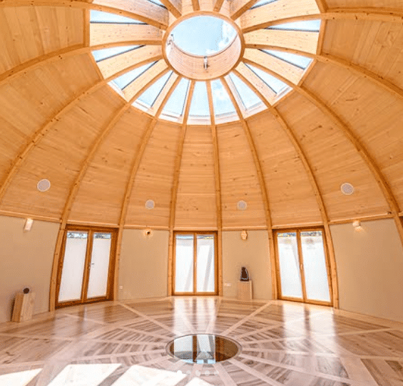 Sunlit Interior Of Wooden Dome Yoga Studio