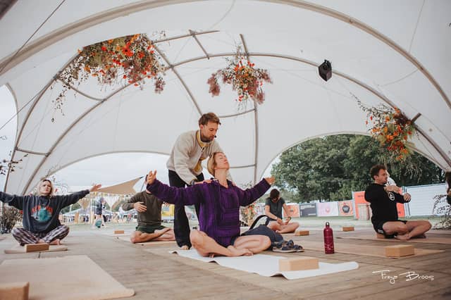 Festival Dome Teacher Assisting Seated Pair