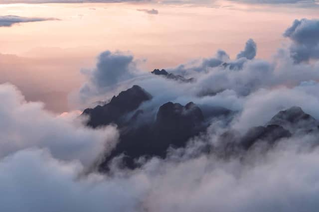 Misty Mountain Peaks At Sunset