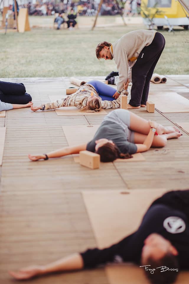 Festival Dome Teacher Assisting Savasana