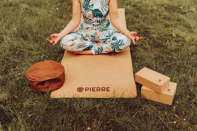 Woman Meditating on PIERRE Cork Yoga Set