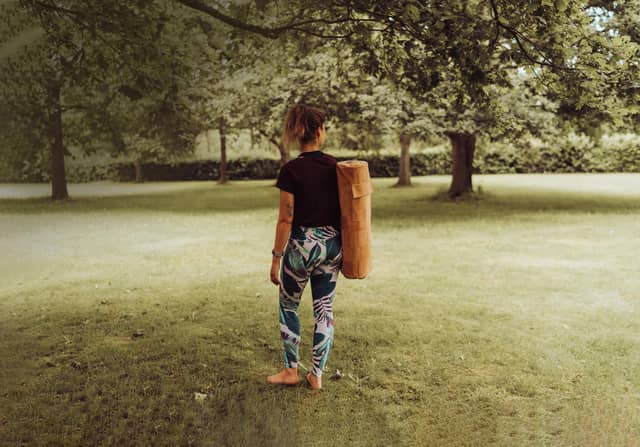 Woman Carrying PIERRE Cork Yoga Mat