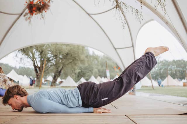 Man Performing Locust Pose on PIERRE Mat