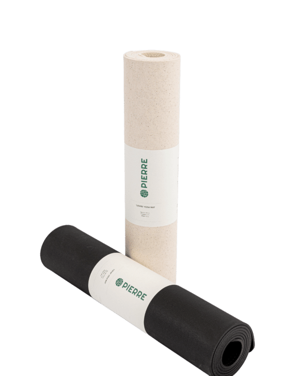 Two rolled Pierre Sports eco-friendly yoga mats, one beige and one black, with brand labels on a black background.